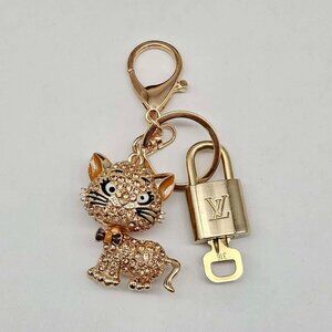 Authentic Louis Vuitton Lock & Key with unbranded Cat Bagcharm Keucharm 123125